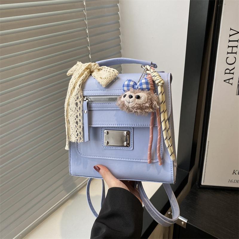 

Beautiful and exquisite women s backpack, college style, sweet students commute to class, versatile single shoulder messenger bag women no pendant синій