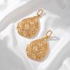 Gold-plated jewelry hollow woven pattern bag earrings women's niche design geometric round ring earrings fashion temperament earrings