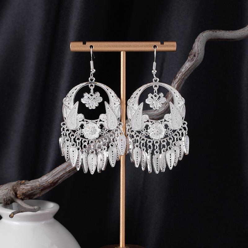 Bohemian Ethnic Miao Silver Tassel Earrings with Butterfly, Peacock, and Flower Design for Women – Long Dangle Jewelry for Travel Photos.