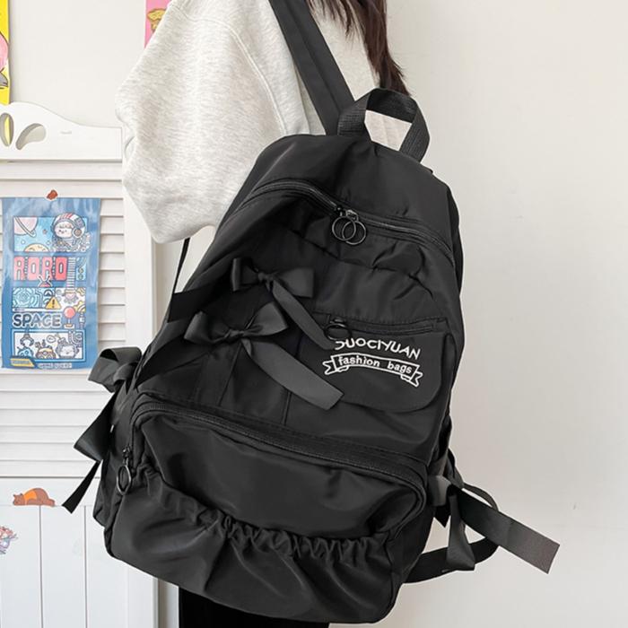 Милый контрастный рюкзак для студента с плиссировкой и персонализацией в виде банта-бабочки 30x15x40cm чёрный 2340₽