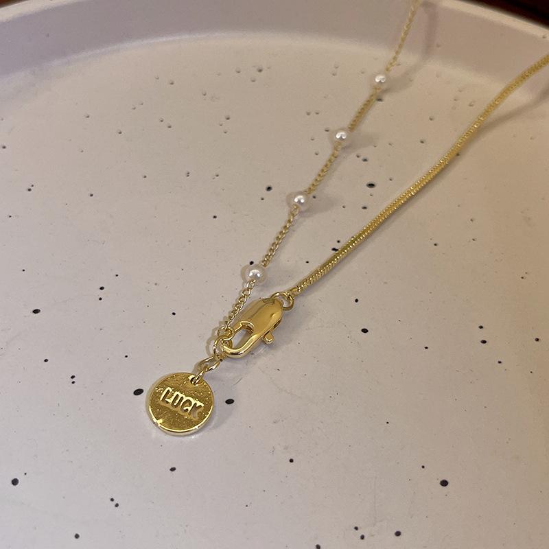 2023 Elegant Pearl Pendant Necklace: Niche Design Sweater Chain for Women