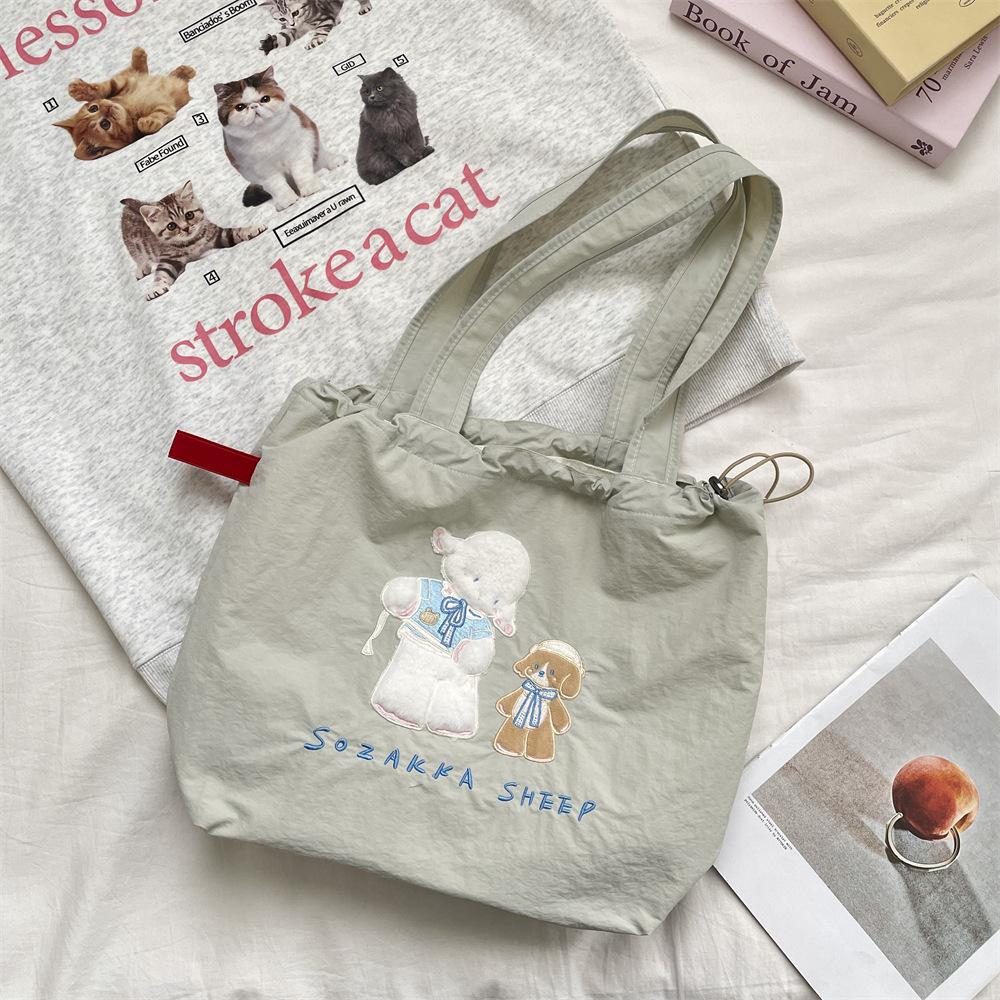 5 cute cartoon embroidered canvas bag large capacity women's simple versatile drawstring bundle single shoulder handbag