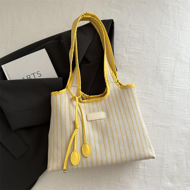 Large capacity tote bag women's new versatile canvas striped commuter shoulder bag women's casual armpit bag