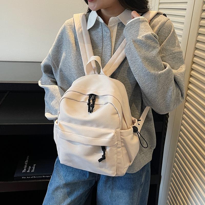 Minimalist Backpack for Women and Men Lightweight Nylon School Bag with Front Pocket