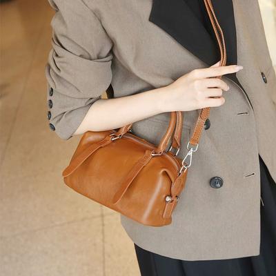 Die neue Tasche Leder Crossbody Handtasche Einfache echtes Leder Schulterkissen Tasche
