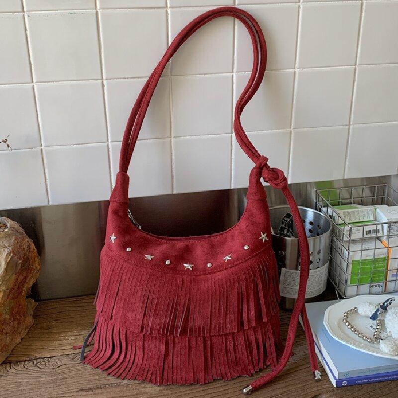 Retro tassel bag women's fashion casual foreign style shoulder messenger bag personalized rivet dumpling bag