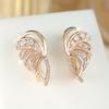 Exquisite wing-shaped design with geometric stripes and delicate, round-cut white cubic zirconia studs Fashionable and unique style