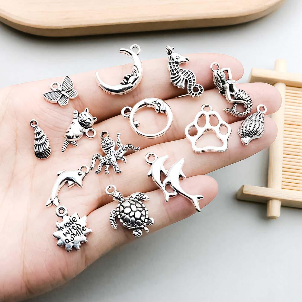 Set di 100 Ciondoli Gatto Farfalla Luna Argento Antico per Braccialetti e Collane Fai da Te
