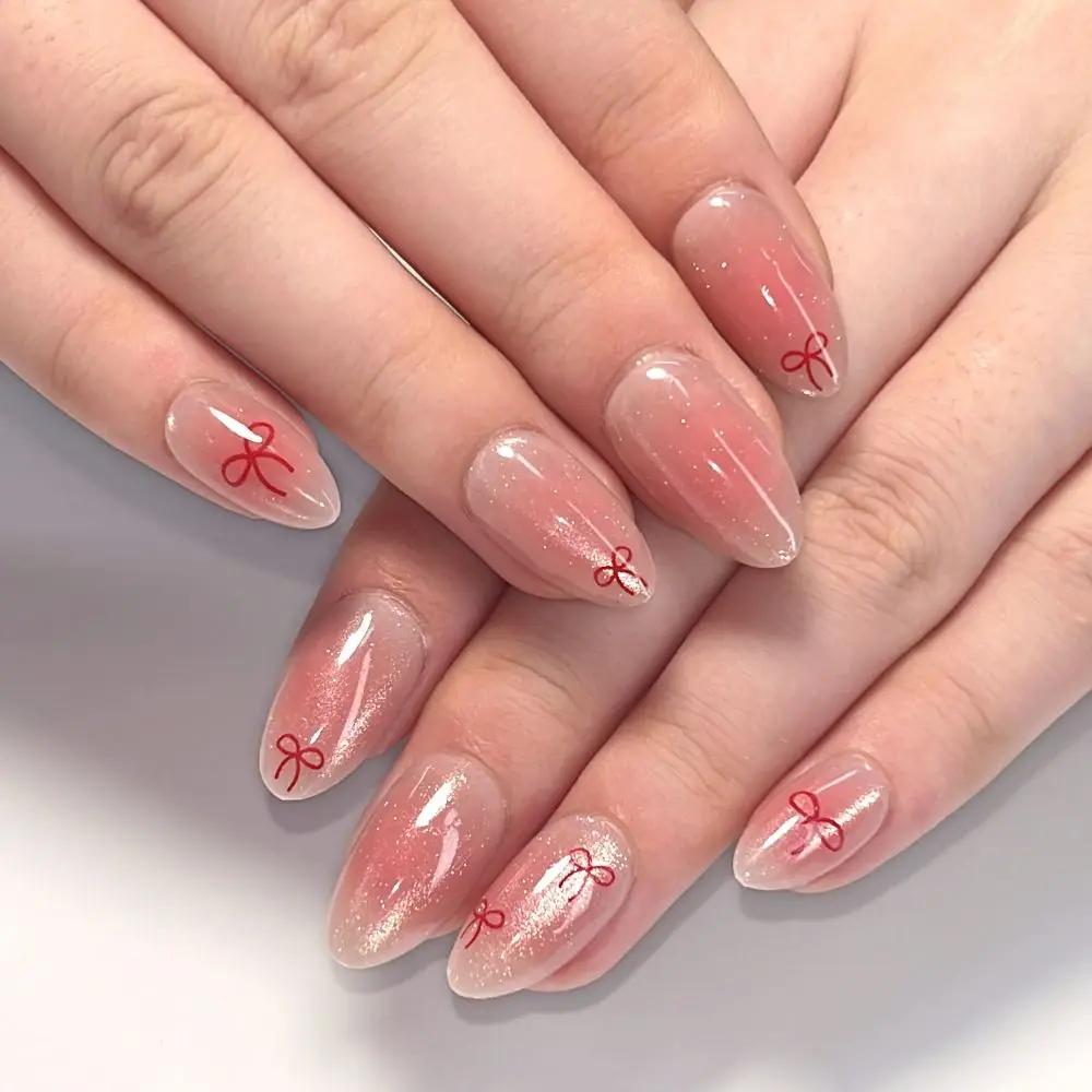 24Pcs Sweet Pink Almond Fake Nails Stiletto Pink Bowknot French Cute Pearl Bows Fake Nails Girls Women Wearable Manicure