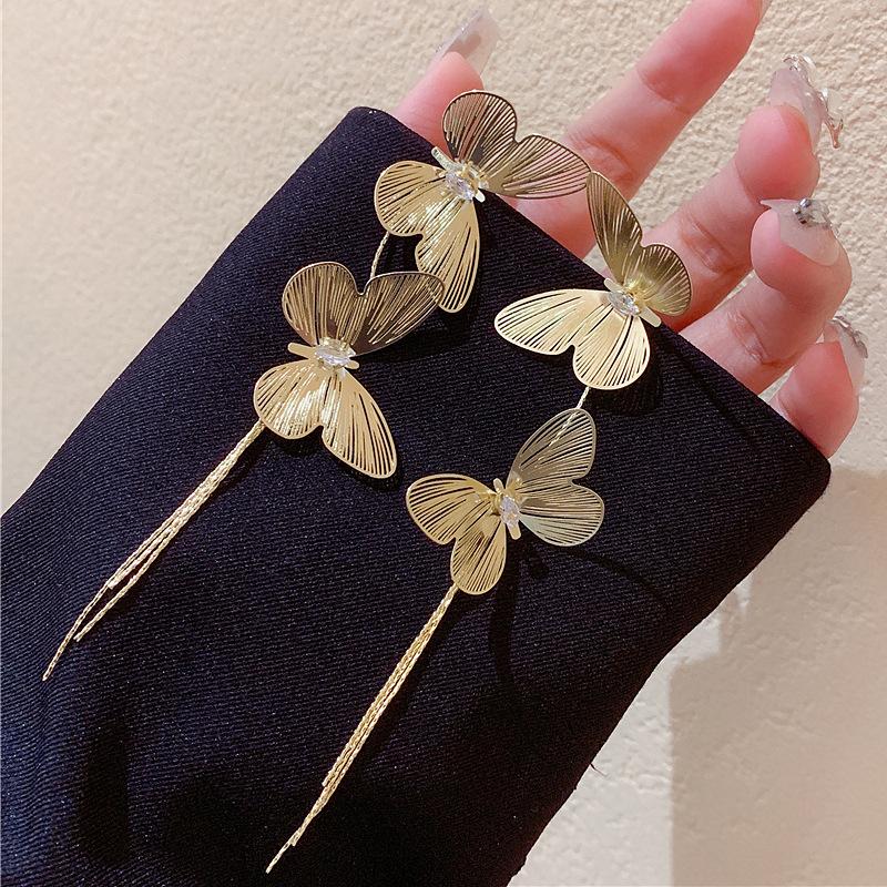 

European and American exaggerated metal butterfly fringed earrings, women s personality design, unique high-end earrings, fashion temperament earrings 925 silver needle