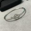 Stainless Steel V-Gold Plated Key Charm Knot Bracelet With Full Rhinestone Embellishment Handcrafted Hollow Design Women