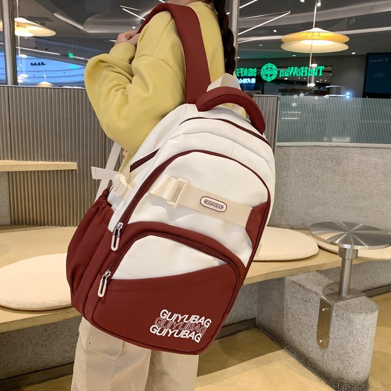 

New Fashion Style Junior High School and College Students School Bag Large Capacity Lightweight Backpack Simple Texture Backpack