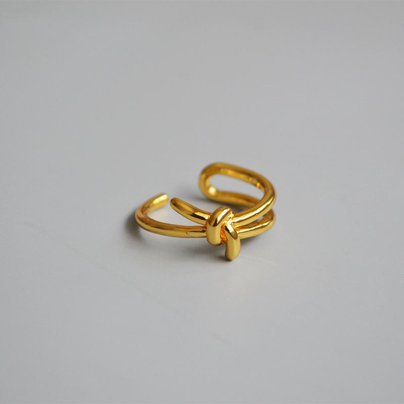 

Minimalist European & American Gold-Plated Brass Knot Ring for Women золотой