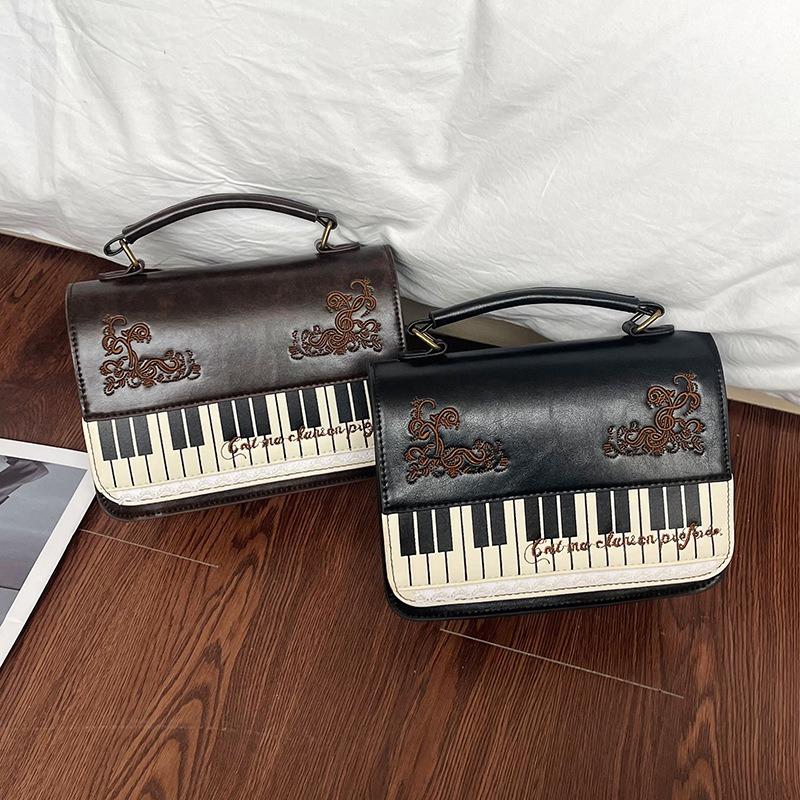 Bolso de mensajero de encaje de piano literario retro de alto valor, bolso de mano versátil, mochila simple, maletín, bolso de hombro