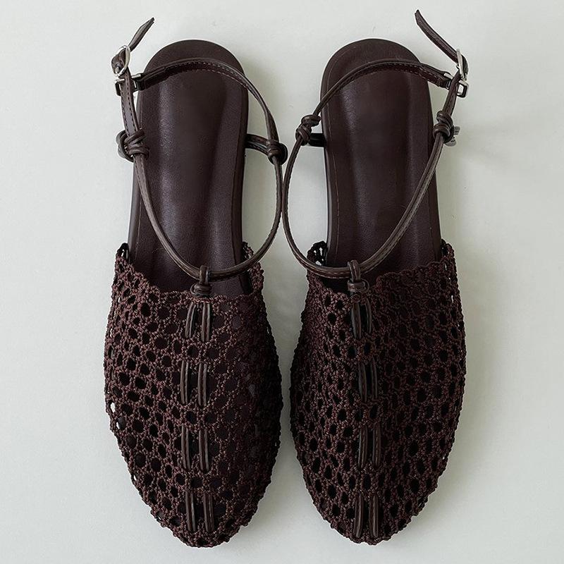 Sheepskin summer new niche woven Roman shoes one-word buckle flat bottom fishing net bag head sandals women wear half slippers