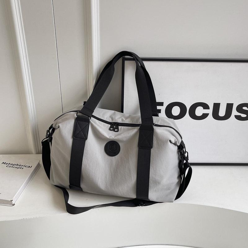 Korean Version of Simple Fashion Fitness Bag Large Capacity Hand Luggage Bag Women's Sports Travel Bag Portable Trend