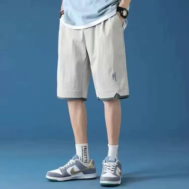 

Мужские модные баскетбольные шорты из ледяного шелка - Повседневные, свободные и универсальные шорты до колена 2XL серый