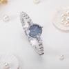 2025 Silver ladies pearl bracelet alloy case rhinestone scale French elegant fashion fairy quartz watch party gift for ladies.