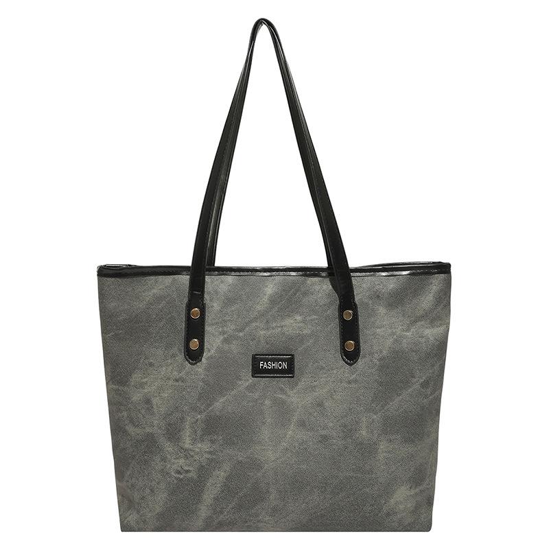 Sac à bandoulière polyvalent haut de gamme sac cabas rétro sac à bandoulière de mode pour les trajets quotidiens sac à bandoulière simple polyvalent de niche sac sous le bras
