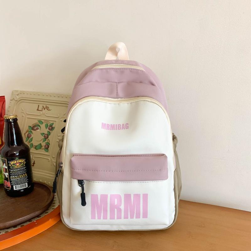 

Large-capacity schoolbag for female junior high school students and high school students 2025 new Korean version of campus contrasting backpack trave фіолетовий