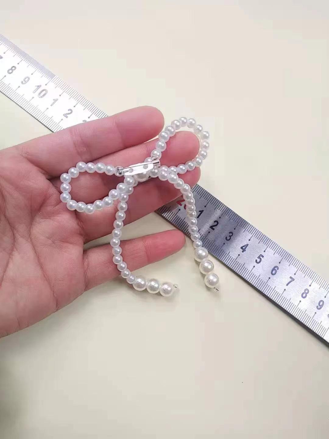 

Жемчужная брошь-бант - Универсальное украшение-корсет для свитеров, вечерних платьев и пальто