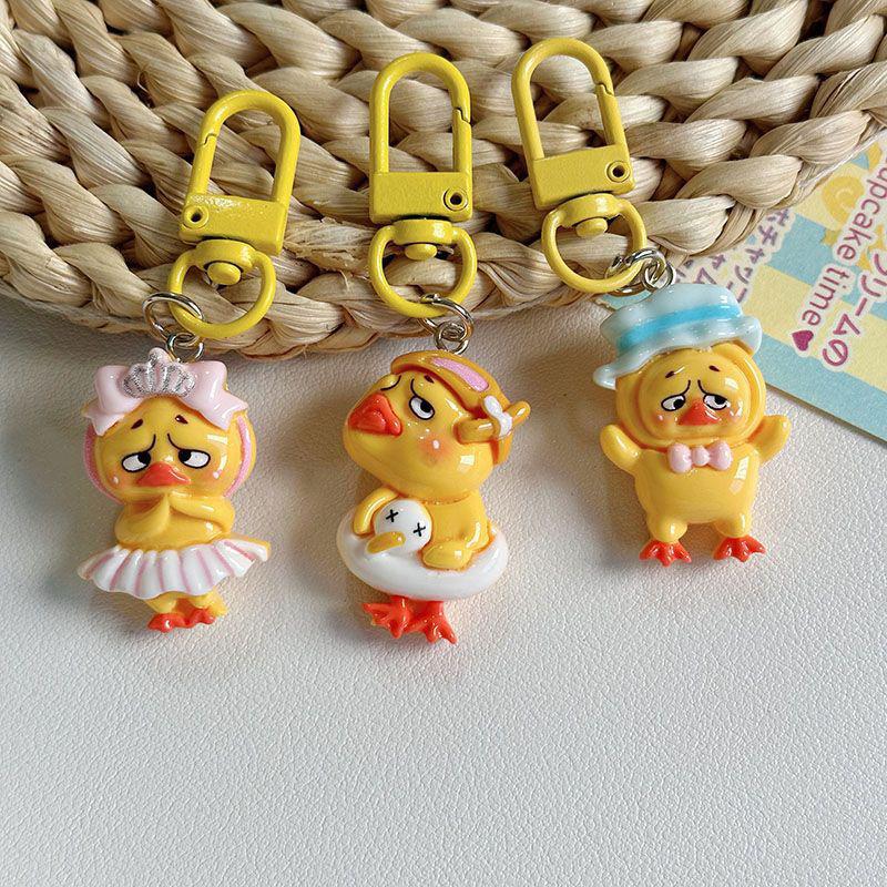 Kawaii Upsetduck Yellow Duck Resin Doll Keychain Pendant Keyring For Girls Backpack Charm Headphone Case Accessories Couple Gift