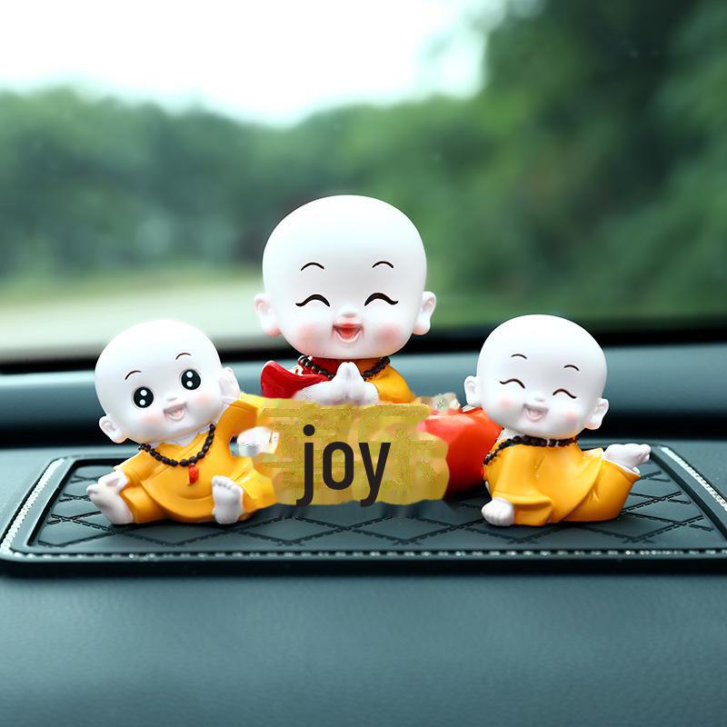 Creative Little Monk Maitreya Buddha Car Ornament: Cute, Shaking Head Resin Doll for Car Interior Decoration and Safety.