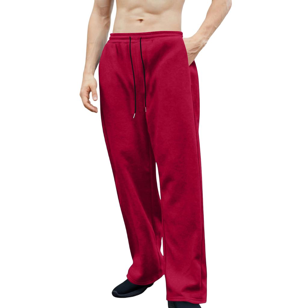 Pánské tepláky s elastickým pasem, rovný a široký střih, volný střih, s kapsami v pase.