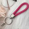 Gevlochten Lederen Touw Sleutelhanger met Poppenhanger - Modieus en Creatief Accessoire