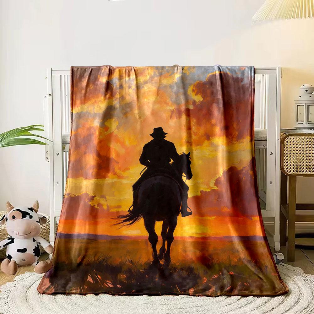 Silhouette of a horseback rider against a vibrant sunset with clouds. for all seasons blanket lunch break throw gift 80cm x 120cm