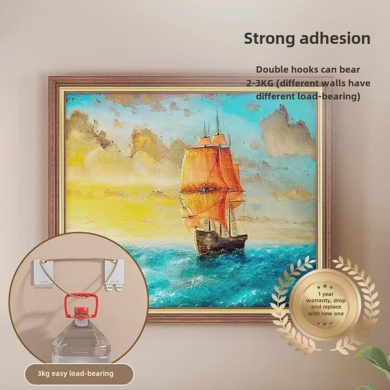 Spårlös väggkrok för foton och målningar