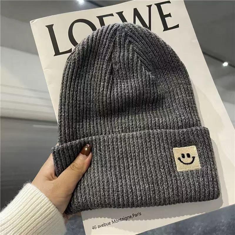 Devil smiley face label wool hat women's autumn and winter warm trend versatile ear protector black knitted hat