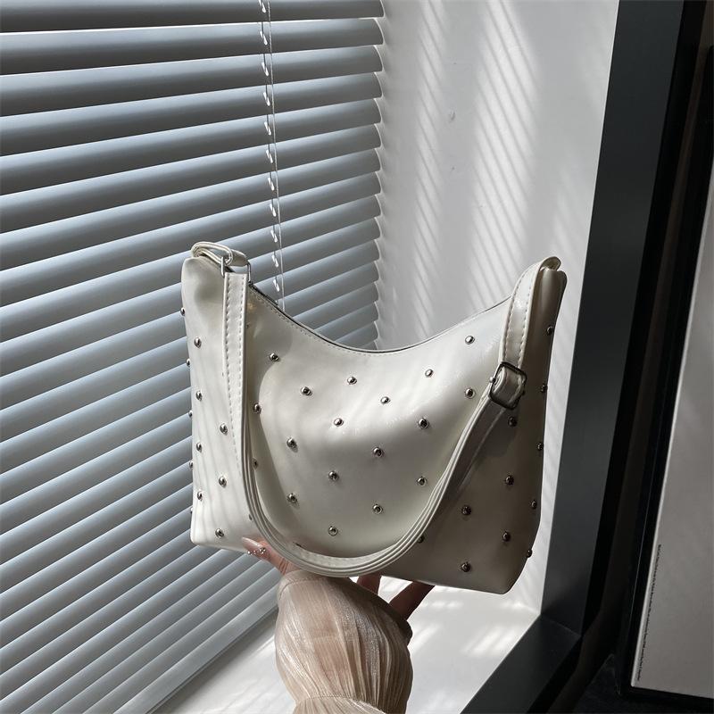 Stylish and simple rivet underarm bag women's new versatile dumpling bag high-end retro messenger bag