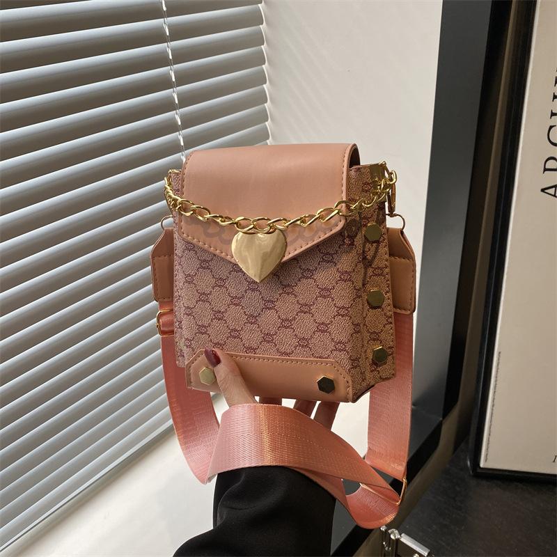 

Новая высококачественная текстура вертикальный ретро тренд сумка для мобильного телефона сумка для хранения сумка через плечо сумка-мессенджер женская розовый