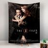 A man and woman in formal attire embracing with "The X-Files III" title. Patterned tapestry for bedroom and living room home decor