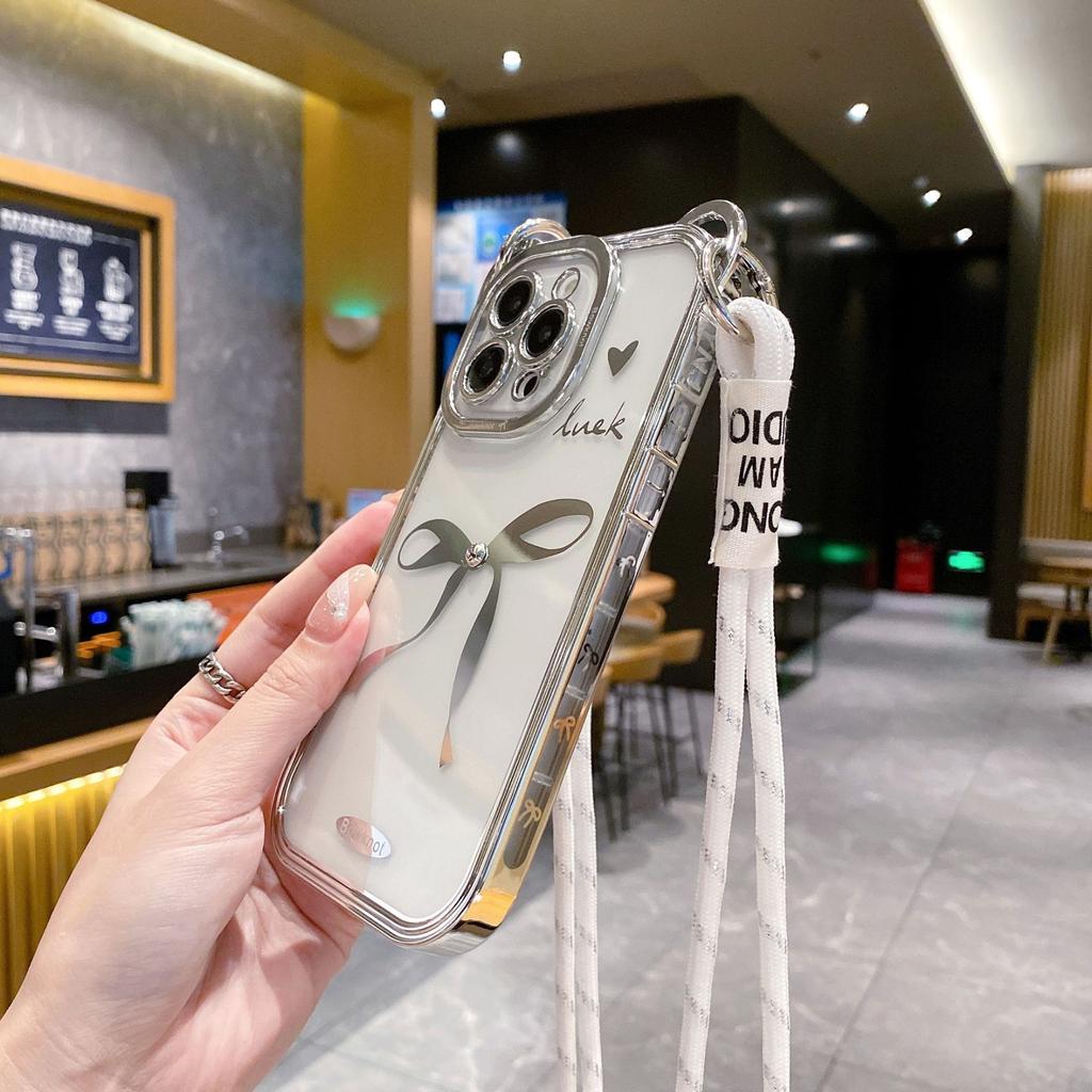The Bow Tie Crossbody Lanyard Is Suitable for IPhone15promax Phone Cases. It Features A Simple Apple 14 Electroplated Anti-drop Soft Case