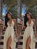 2026 European Summer V-Neck Wrap Dress: Sexy Resort Style with Slit and Flowy Hem