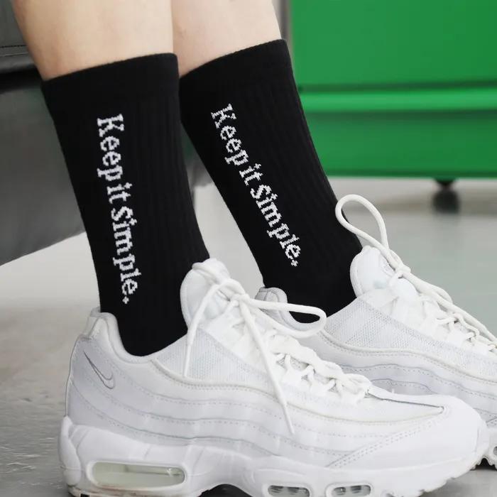 Black lettering sports socks keep it simple.
