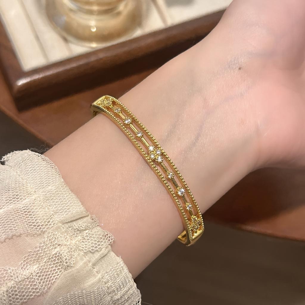 Luxurious hollow lace floral design inlaid with synthetic zirconium, copper open bangle with delicate beaded edges and carved patterns, a delicate