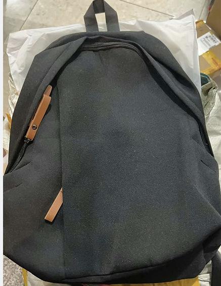 A Male College Student with A Small Simple Large-capacity Computer Backpack