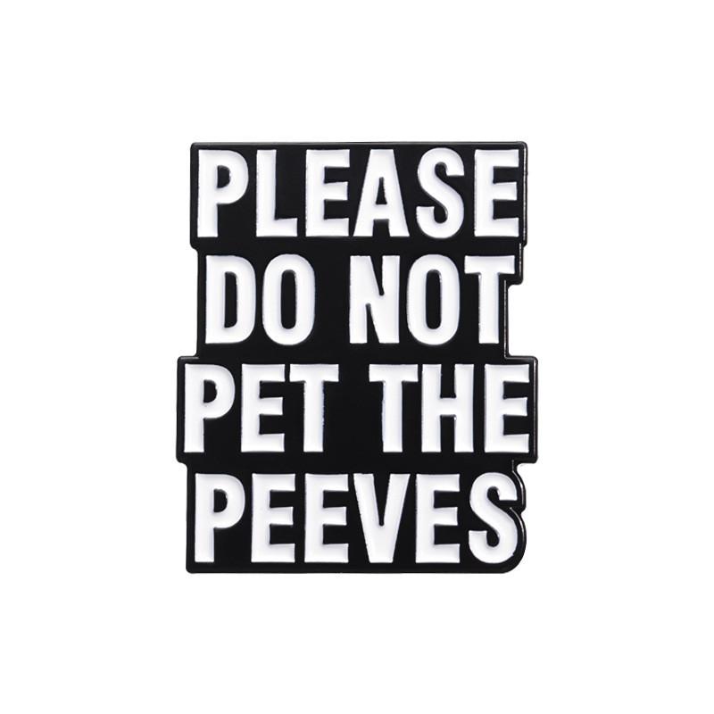 

Black And Stylish White Lettered Brooch With Enamel Finish Perfect For Fashion Accessories