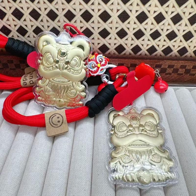 Goldener Löwentanz-Anhänger mit 20 mg Gold - Schlüsselanhänger und Handykette im Nationalen Trend als Geschenk.