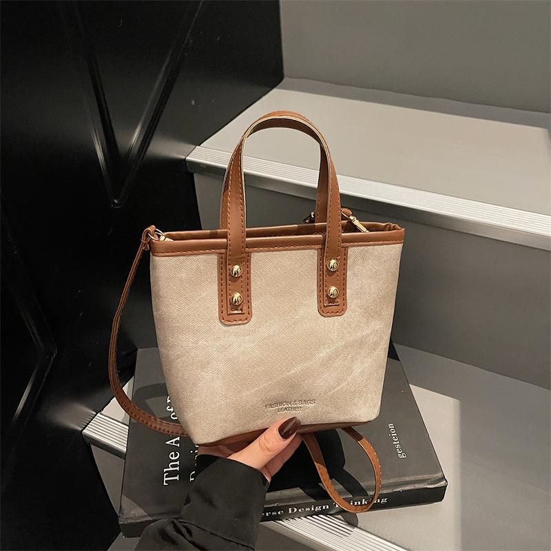 

Ретро контрастная маленькая сумка женская 2025 лето новая портативная сумка-ведро простая текстура для поездок на работу универсальная сумка-мессенджер