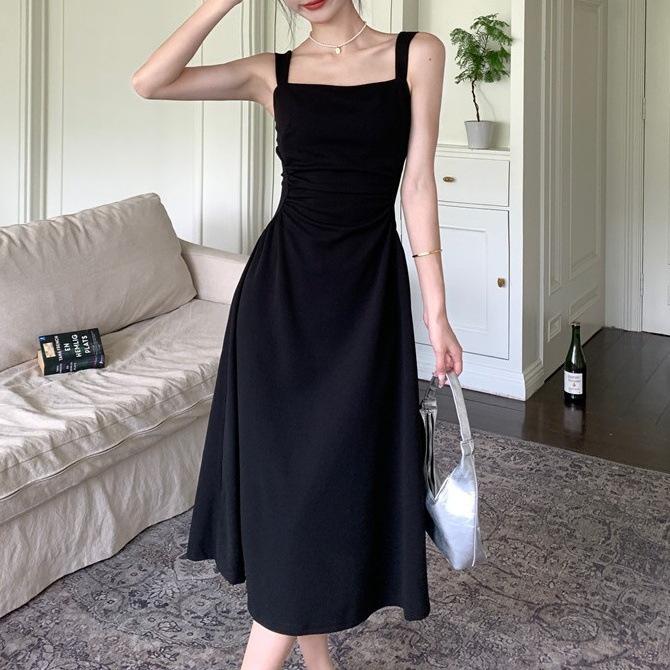 Fashion waist fold design suspender dress women's early spring Korean version fashion solid color high-end medium and long skirt