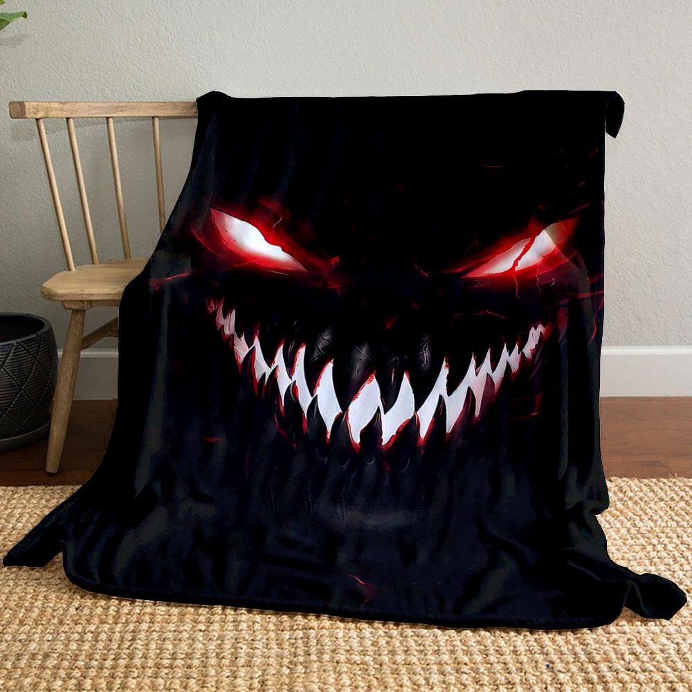 Sinister, glowing red eyes and sharp white teeth in a dark background. for all seasons blanket lunch break throw gift