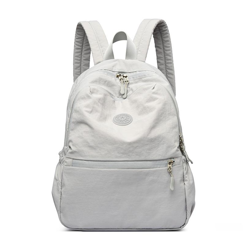 

Дорожный легкий рюкзак женский водонепроницаемый большой вместимости светло-серый