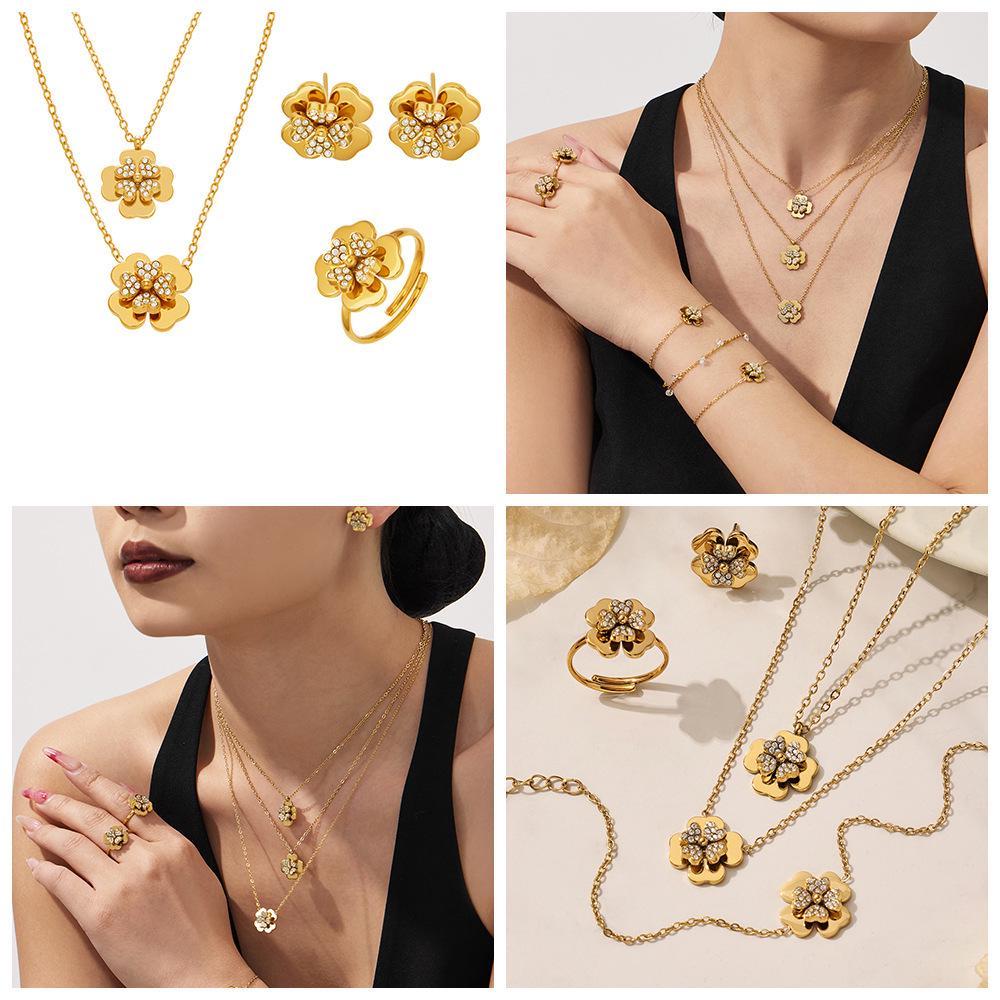 European & American Light Luxury Clover Jewelry Set: Stainless Steel, Zirconia-Embedded, Versatile Necklace, Bracelet, Ring & Earrings for Women.