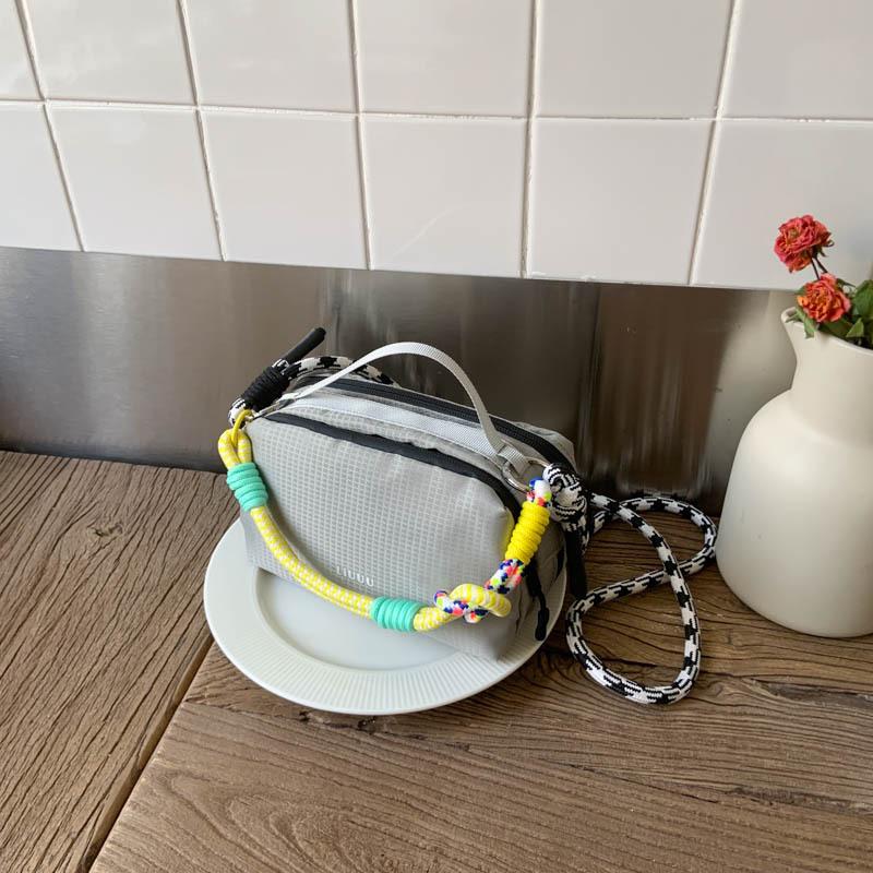 

Niche design dopamine contrasting color portable small square bag women s new lightweight casual shoulder messenger bag серый