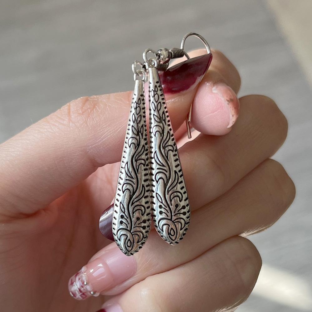 

2026 New Trendy Bohemian Floating Pattern Carved Water Droplet Earrings, Mid Length Ethnic Style Zircon and Headwear