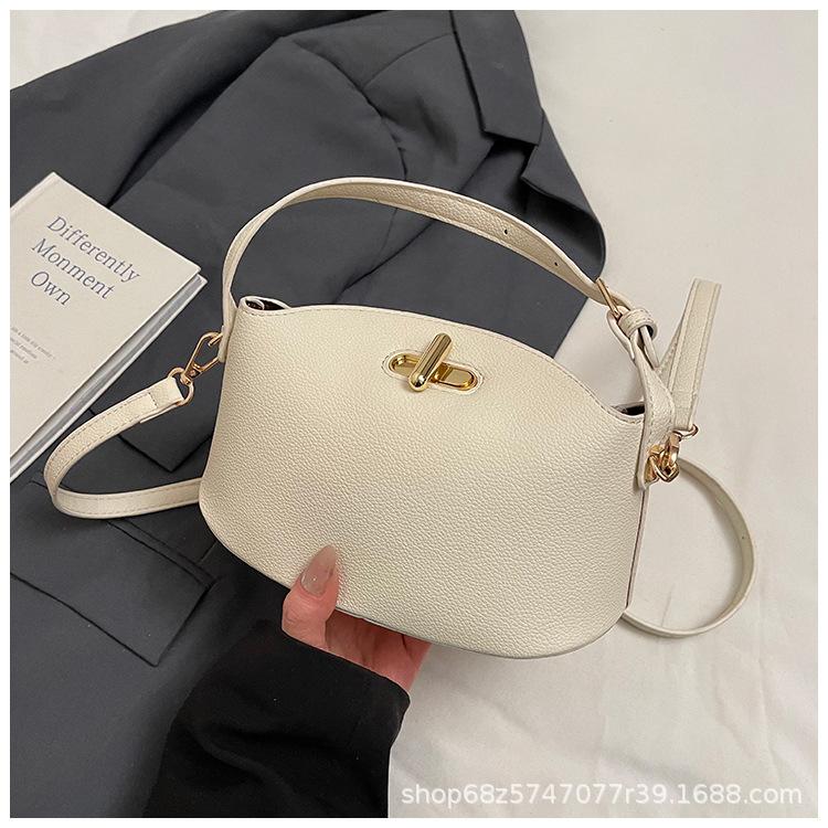 2025 new solid color temperament handbag large-capacity women's bag niche casual one-shoulder real high-end messenger bag